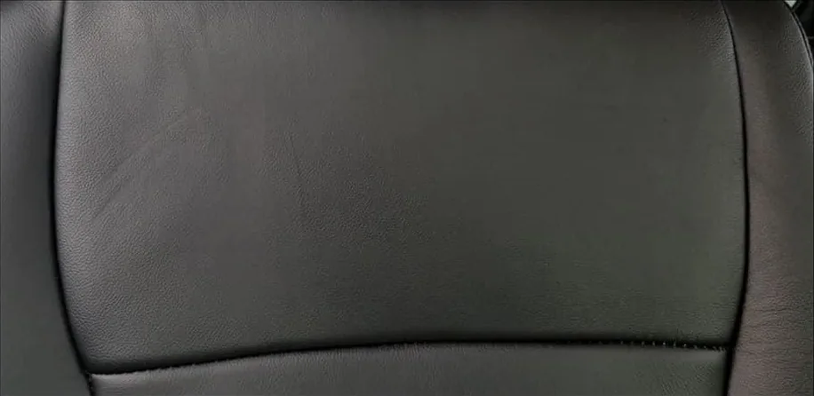 After: Creased leather seat back