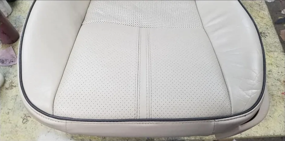 After: Torn perforated leather