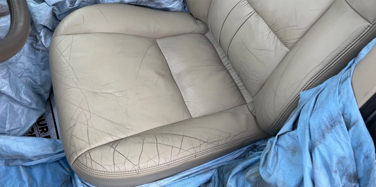 Before: Scuffed leather seat