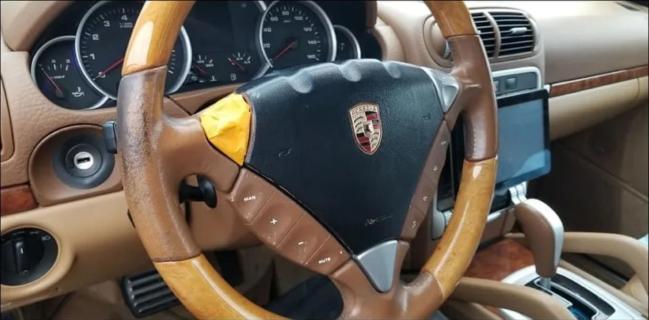 Before: Porsche steering wheel
