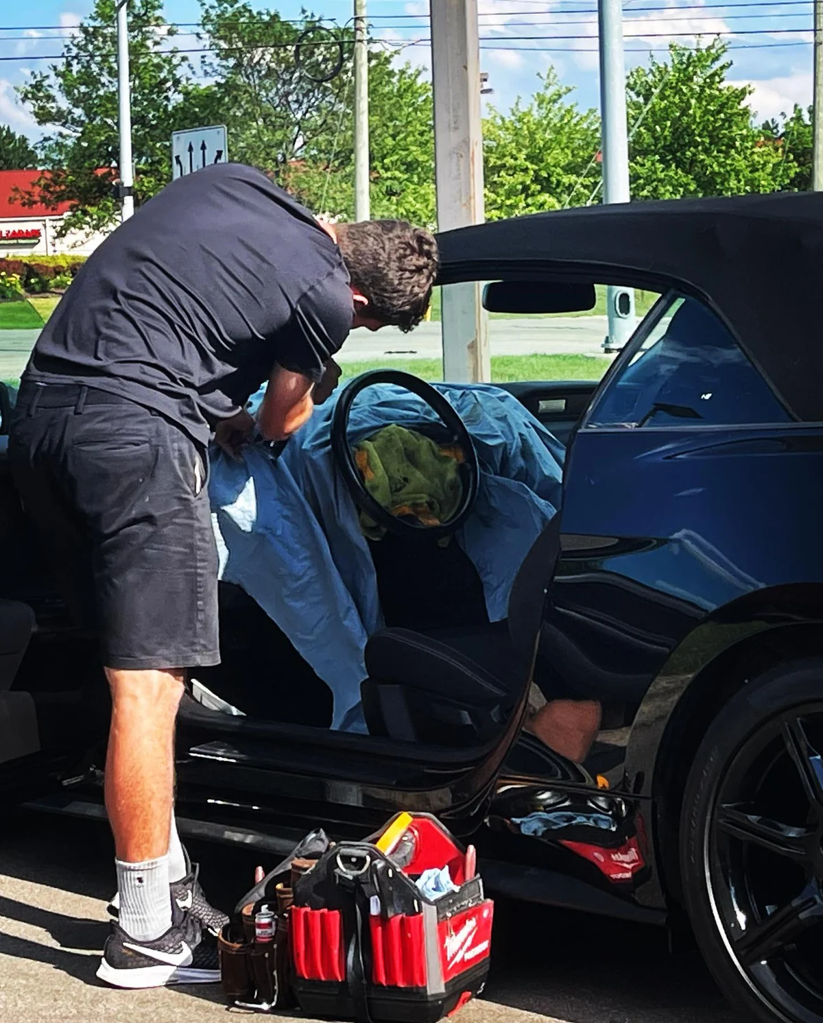 Technician working in a convertible