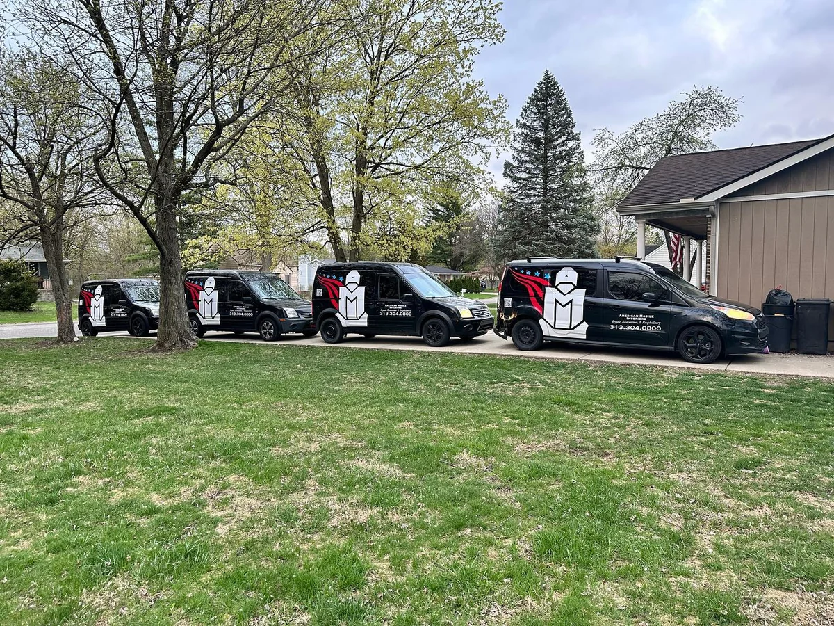 Row of American Mobile Interiors service vans