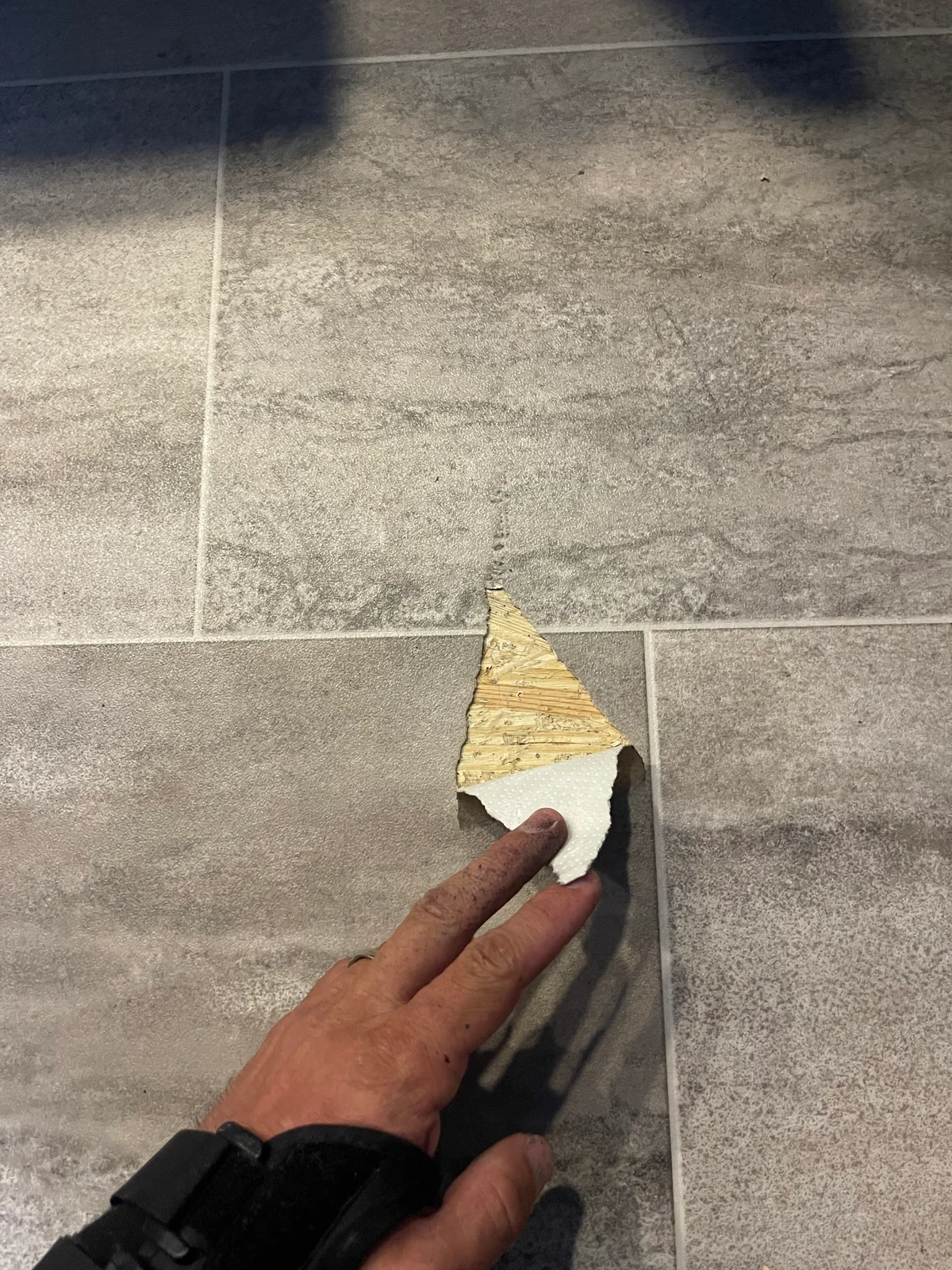 Before: Linoleum floor tear