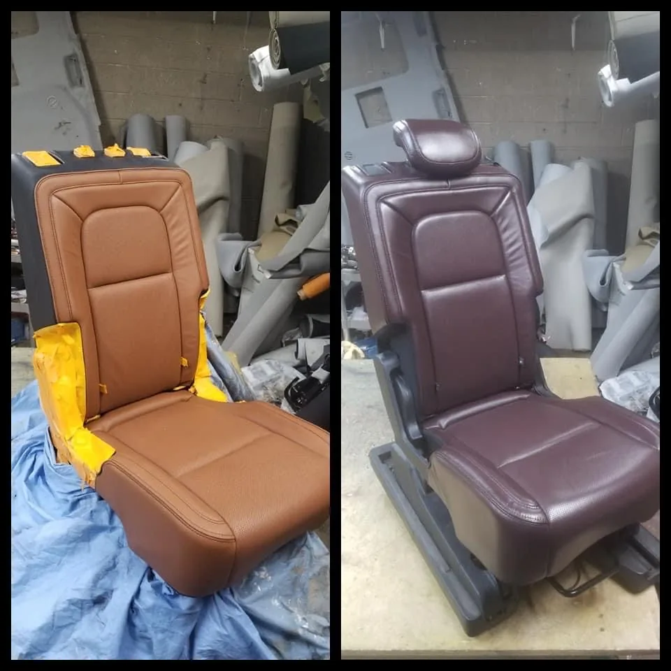 Two rear captain’s chairs in tan and burgundy leather during dye work