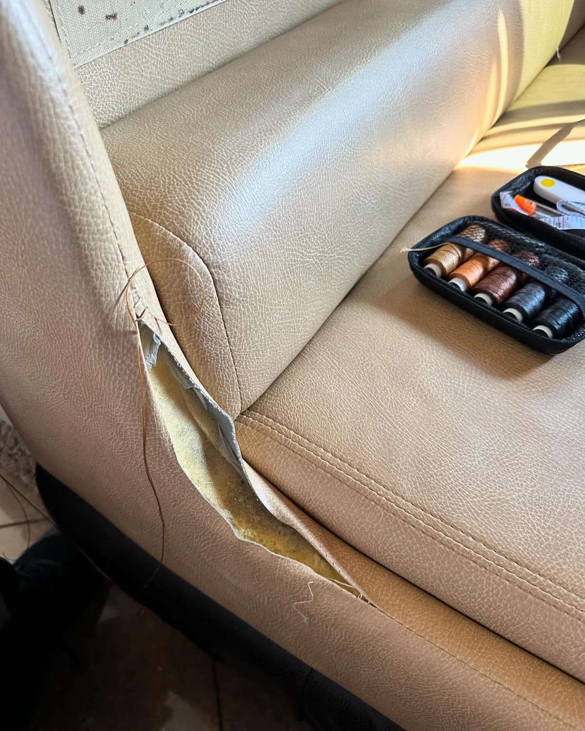 Hand sewing a leather seat seam