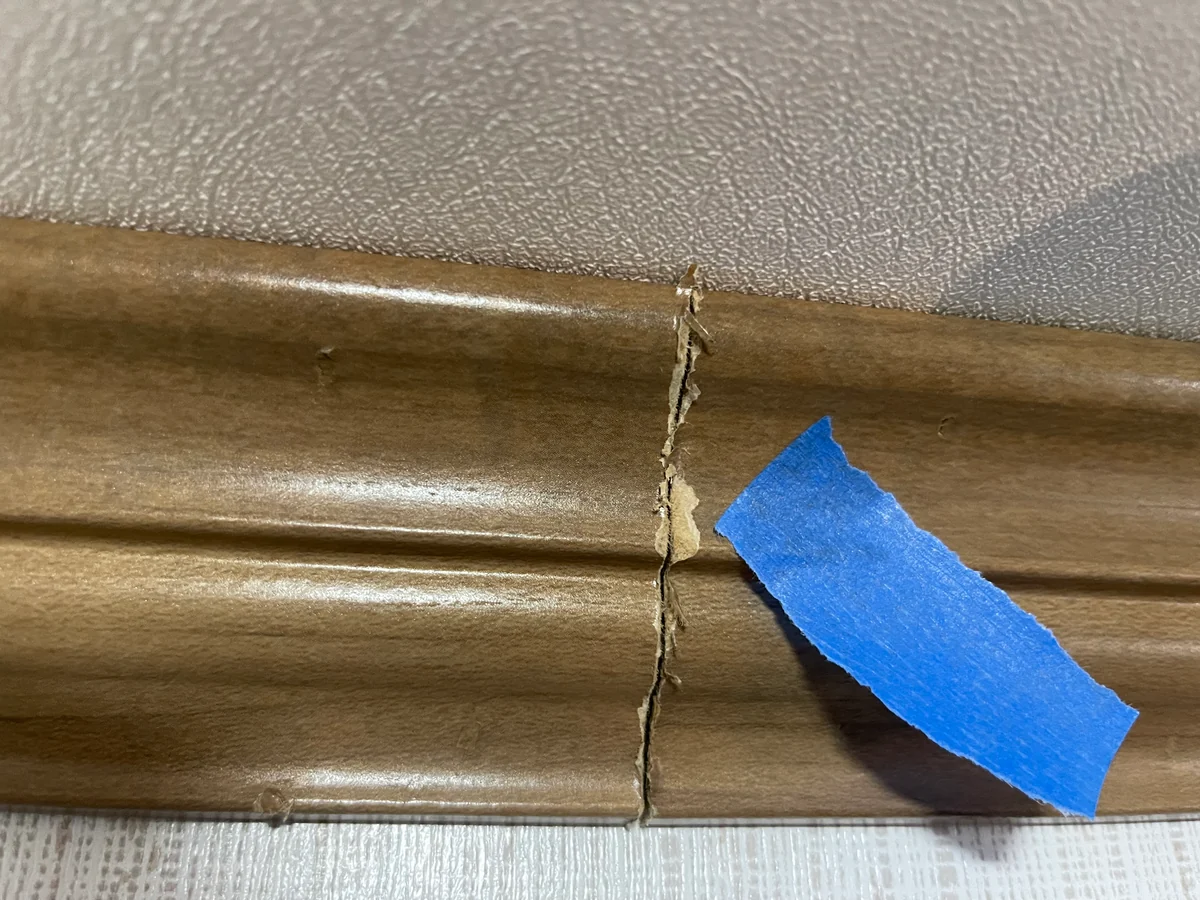 Before: Cracked wood trim